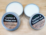 Two tins of Emu Logic Leather & Timber wax on a wooden surface